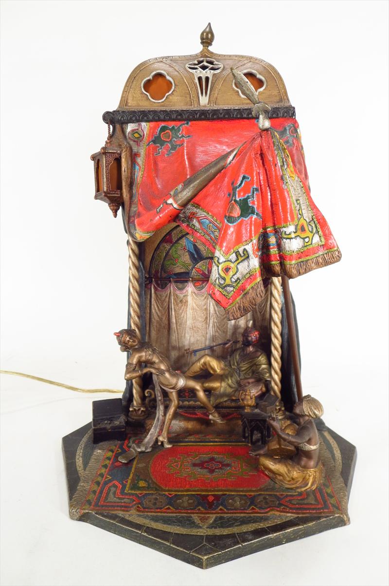 Orientalist Bronze Table Lamp, Viennese, Late 19th C., Man Smoking In Tent Being Entertained, Cold Painted Bronze. Sold For $9,131