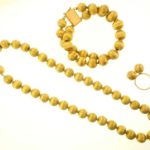 18k Satin Gold Beaded Suite. Sold For $2,750
