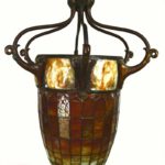 A Rare Tiffany Studios Turtleback Tile, Leaded Glass & Bronze Acorn Form Hanging Lantern. Sold For $117,000.