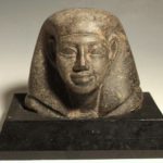 Ancient Egyptian Granite Head Of A Noble Or Official, Dynasty XII, C. 1800 BC. Sold $8,125.