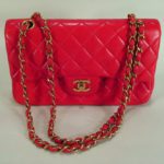 Chanel Classic Red Lambskin Bag Series 2.55. Sold For $1,750.