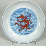 Chinese Iron Red And Underglaze Blue Porcelain Dragon Dish, Qianlong Mark And Period. Sold For $12,187.