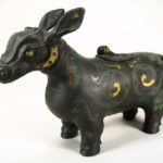 Gilt Decorated Archaic Style Bronze Water Buffalo-Form Incense Burner, Chinese. Sold $33,600.