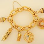 Lot 314. 18K Gold Charm Bracelet With Charms. Sold For $3,000