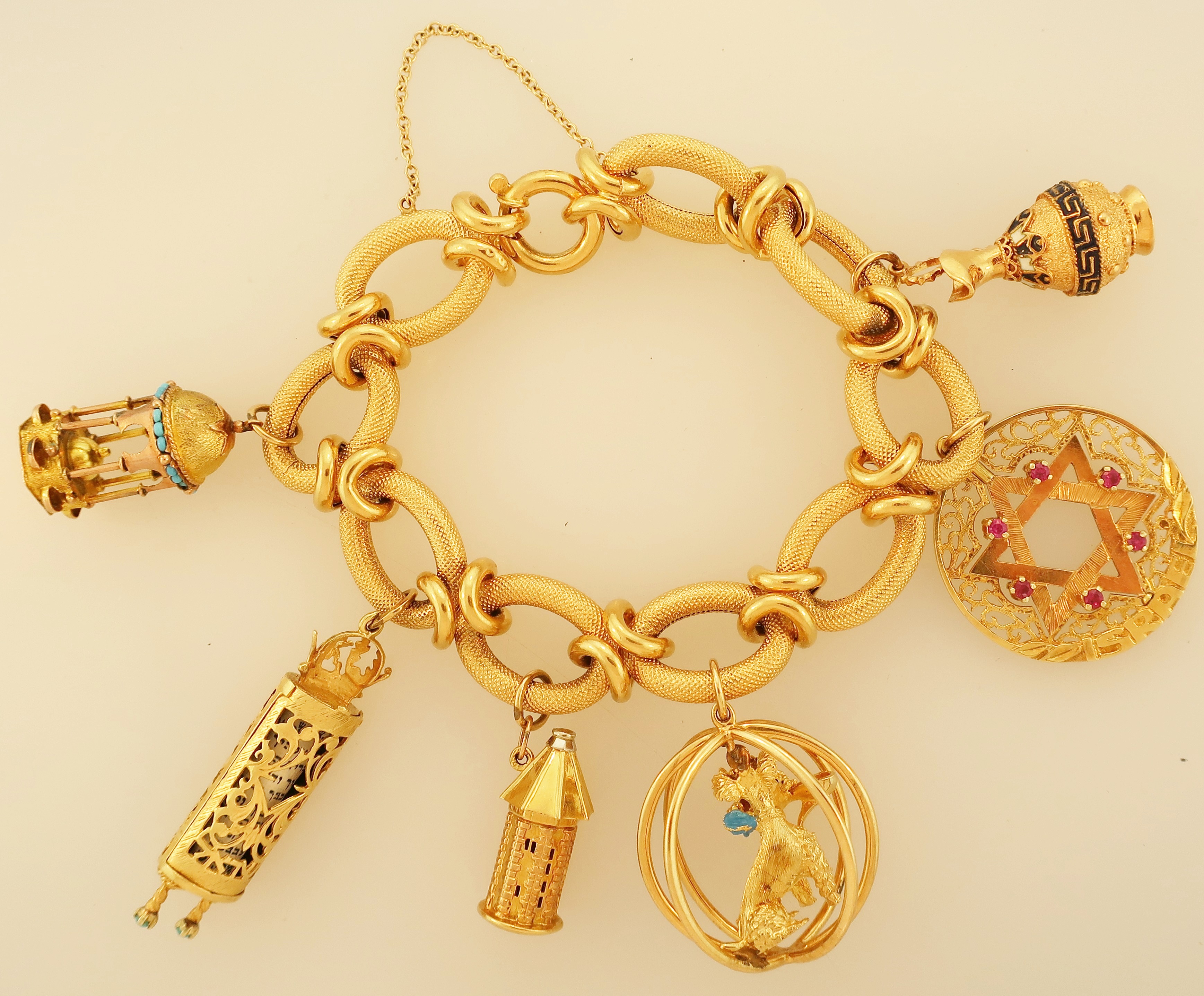 Lot 314. 18K Gold Charm Bracelet With Charms. Sold For $3,000