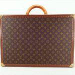 Louis Vuitton Logo’d Hard Side Suitcase, Made In Paris. Sold For $1,073.