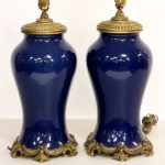 Matching Pair Of Chinese Monochromatic Blue Vases Mounted As Lamps. Sold For $12,025