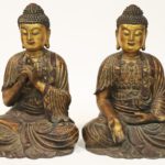 Pair Of Large Bronze Buddhas. Sold For $11,375