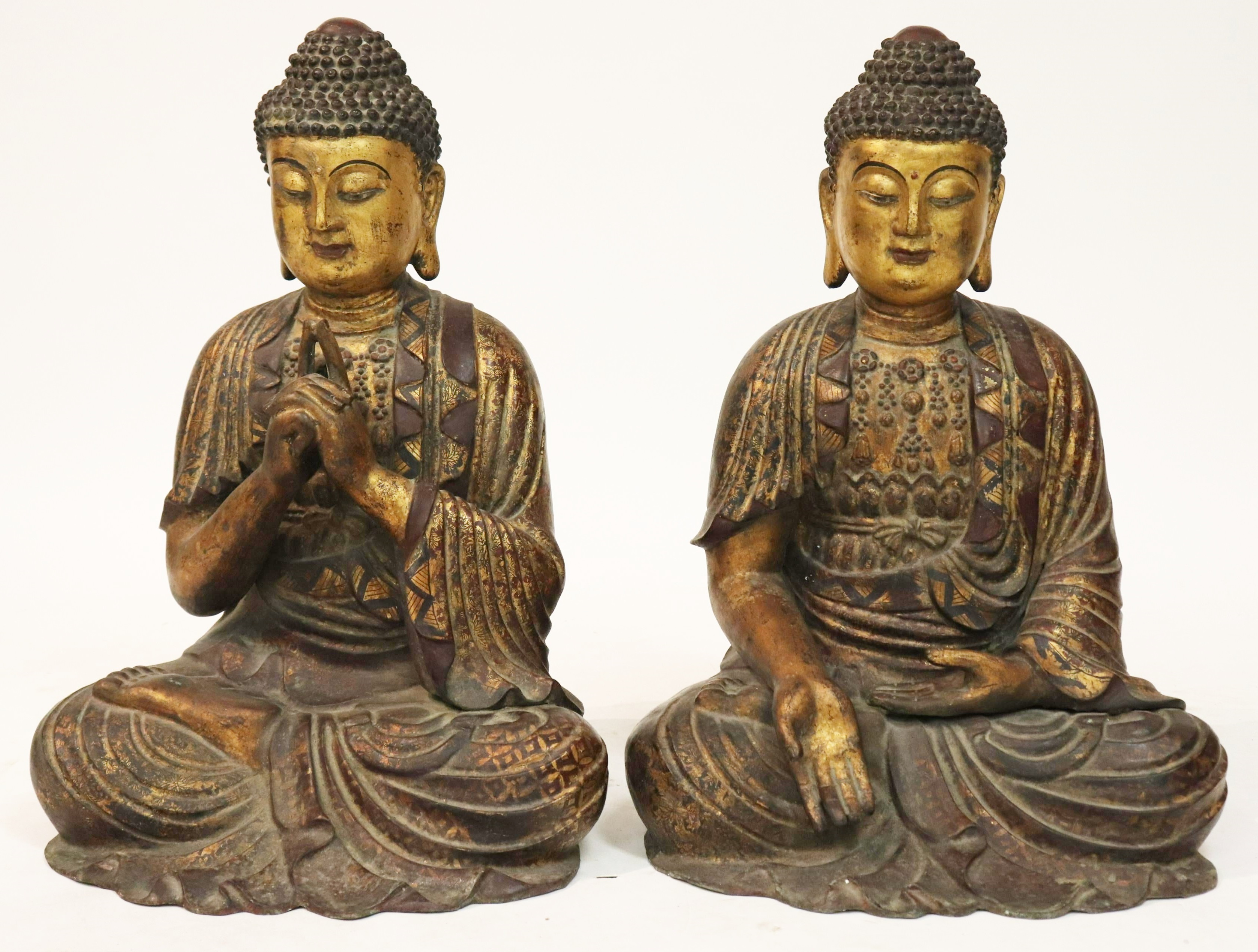 Pair Of Large Bronze Buddhas. Sold For $11,375