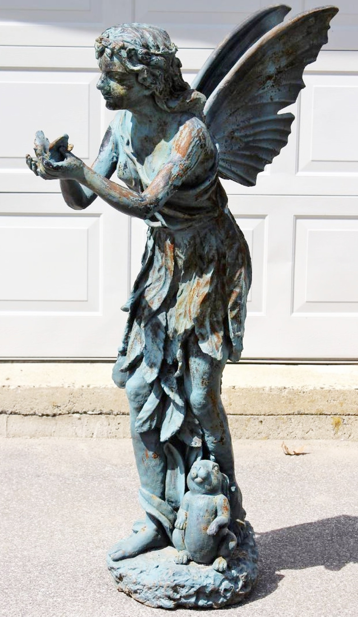 Victorian Cast Iron Angel Holding Songbird, 19th C. Sold For $4,000